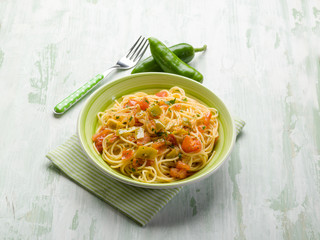spaghetti with green hot chili pepper and fresh tomatoes