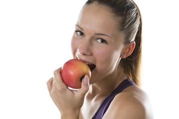 Healthy young woman enjoying a juicy fresh apple