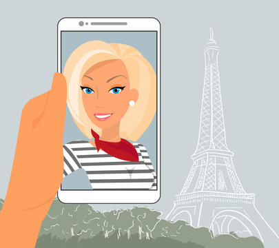Blond woman is showing her photo in Paris displayed in