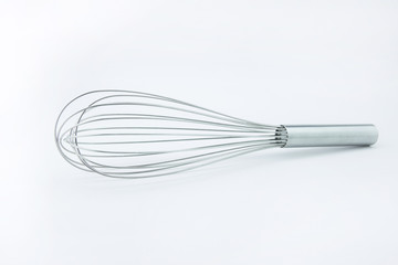 close up of meat whisk on white background