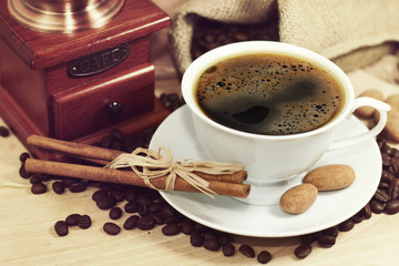 coffee served in a dark cup on wooden table on rustic style