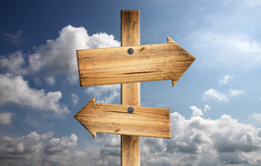 Wood sign on blue sky.