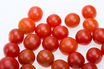 Fresh ripe cherry tomatoes isolated on a white background