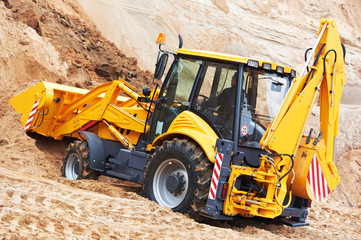 excavator loader at earth moving works