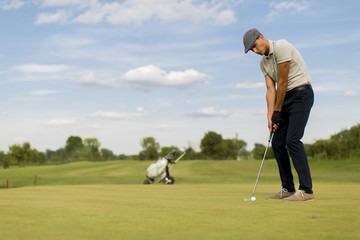 Young man playing golf