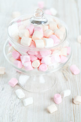 marshmallows in beautiful glass dish on a wooden table