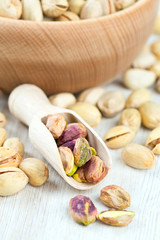 pistachios on wooden surface