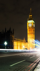 Fototapeta na wymiar Midnight in London with Big Ben and passing traffic.