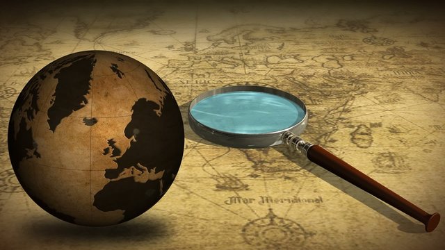 Vintage Rotating Globe map of the world and magnifying glass