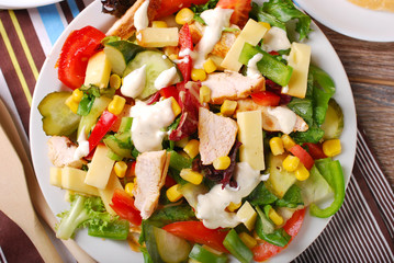chicken salad with cheese and vegetables