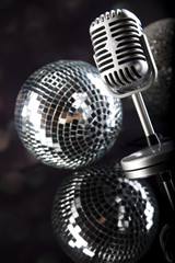 Fototapeta na wymiar Microphone with disco balls