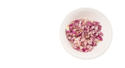 Chopped onions in a bowl over white background