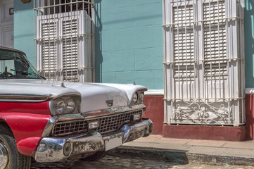 Red and white old american car in Trinidad, Cuba