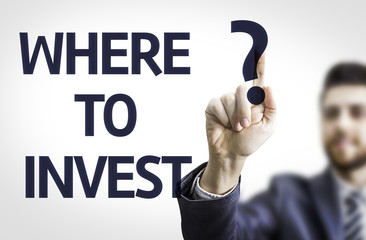 Business man pointing the text: Where to Invest?
