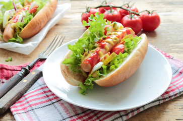 Traditional homemade dot dog with fresh sausage and vegetables