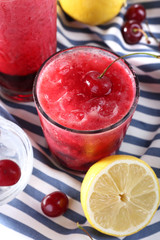 Fresh cold cherry cocktail with mint and lemon