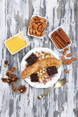Sweetened fried banana on plate, close-up