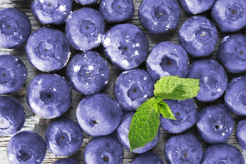 Blueberries on wooden background closeup