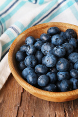 Wooden bowl of blueberries