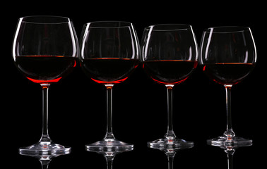 Glasses of wine isolated on black