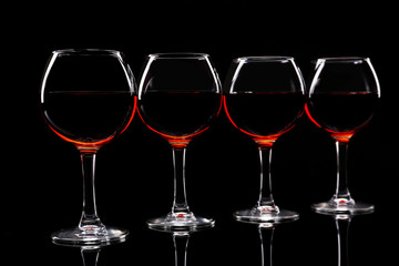 Glasses of wine isolated on black