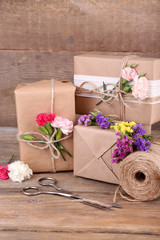 Beautiful gifts with flowers and decorative rope,
