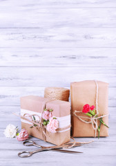 Beautiful gifts with flowers and decorative rope,