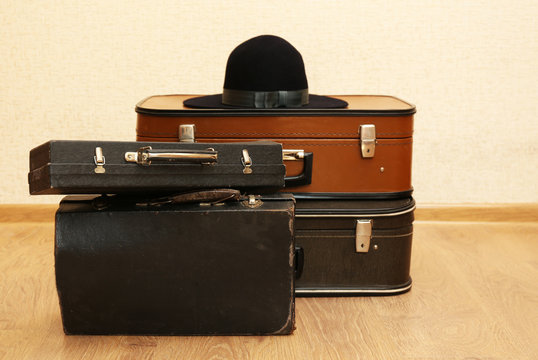 Vintage old travel suitcases on floor