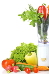 Blender with fresh vegetables isolated on white