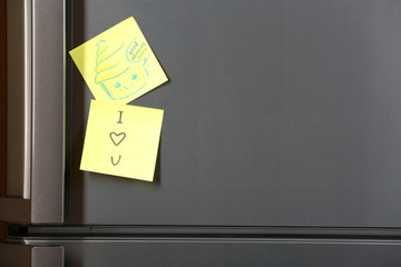 Note on piece of paper on refrigerator closeup © Africa Studio