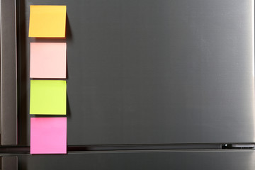 Note on piece of paper on refrigerator closeup © Africa Studio