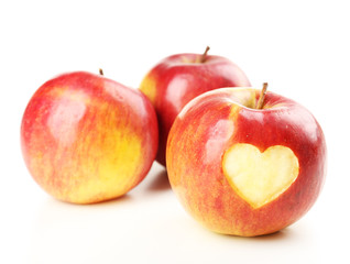 Red apple with heart isolated on white