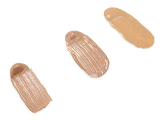 Different liquid foundation isolated on white