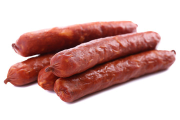 Smoked thin sausages, isolated on white