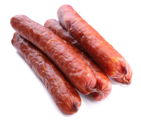 Smoked thin sausages, isolated on white