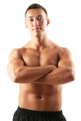 Fototapeta premium Handsome muscle young man isolated on white