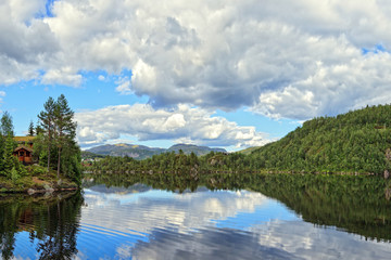 Fototapeta na wymiar Idyllic view of lake with mountains of Norway.