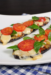 Baked eggplant with tomato and basil and cheese