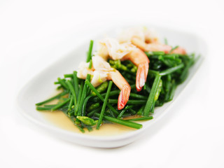 Stir fried shrimps with Chinese chives in plate on white