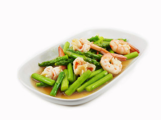 Stir fried shrimps with asparagus in plate on white