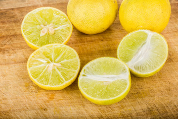 Fototapeta na wymiar group of lemon isolated on wood