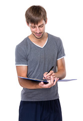 Caucasian man write on clipboard