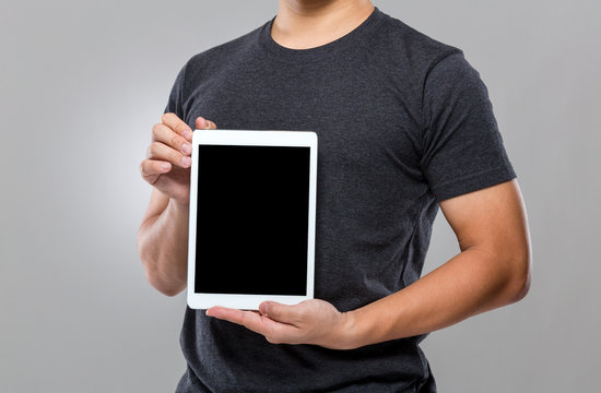 Man show with blank screen of digital tablet