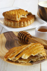 Traditional sweet French breakfast: puff pastry with apple jam