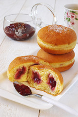 Sweet breakfast: donuts with raspberry jam