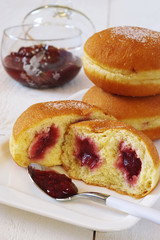 Sweet breakfast: donuts with raspberry jam