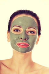 Beautifu toplessl woman with facial mask.