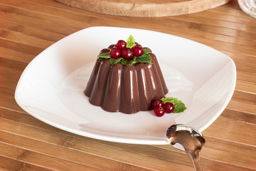 Chocolate pudding with red berries