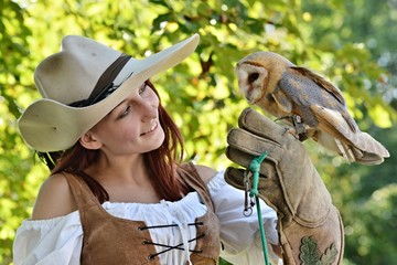 falconer holding barn owl