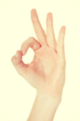 Female's hand showing OK.